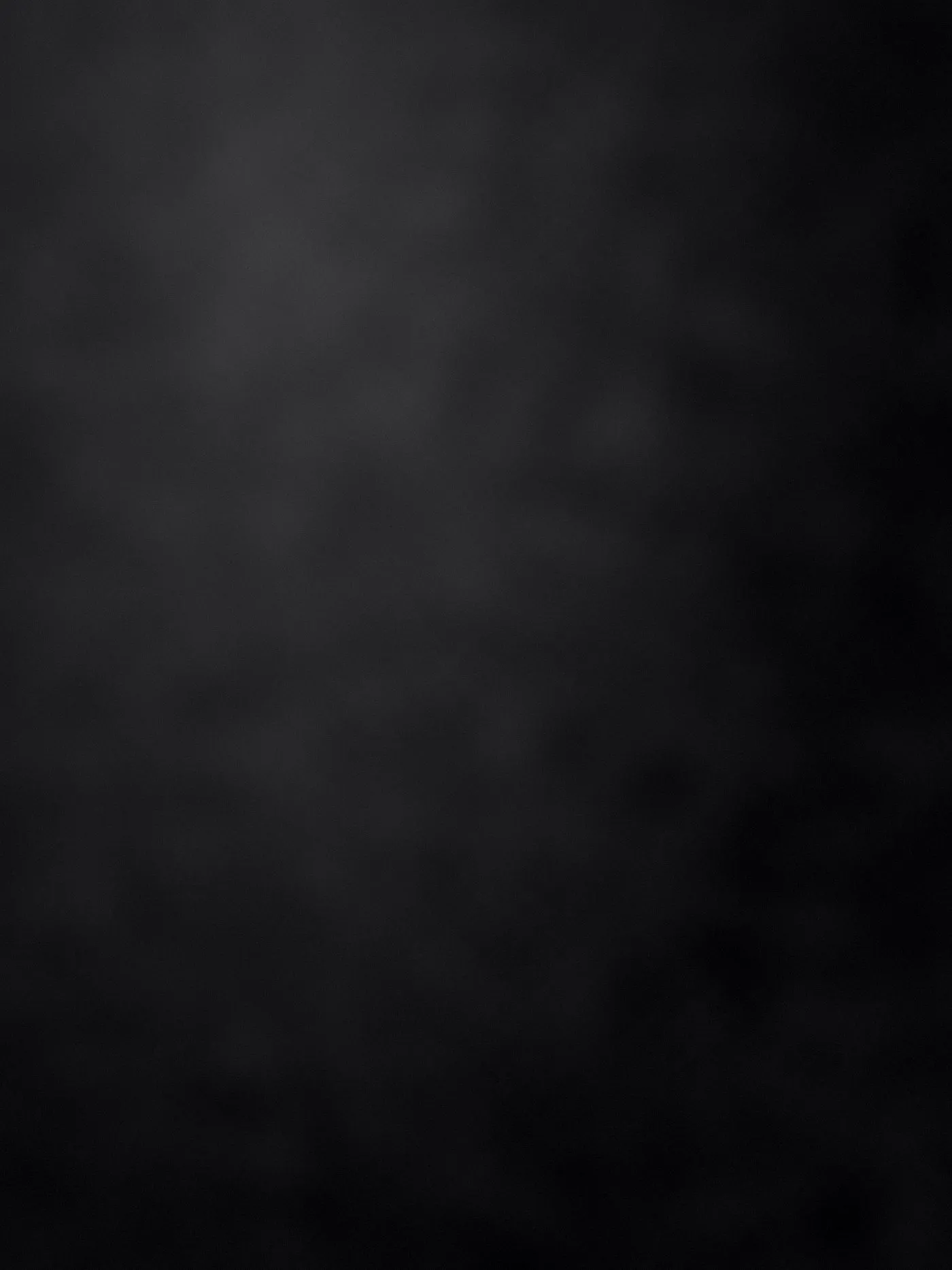 Black cotton ground, light falling from the upper left.